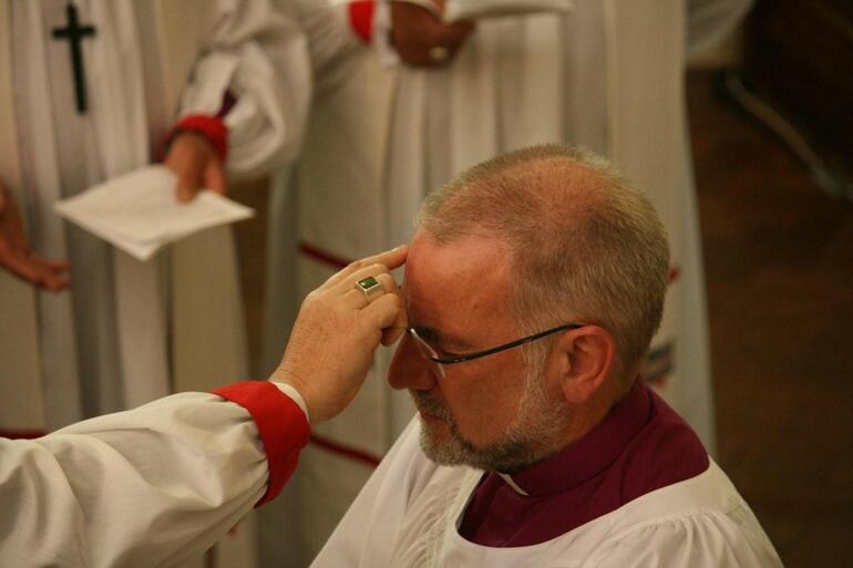 Archbishop David anoints the new bishop.
