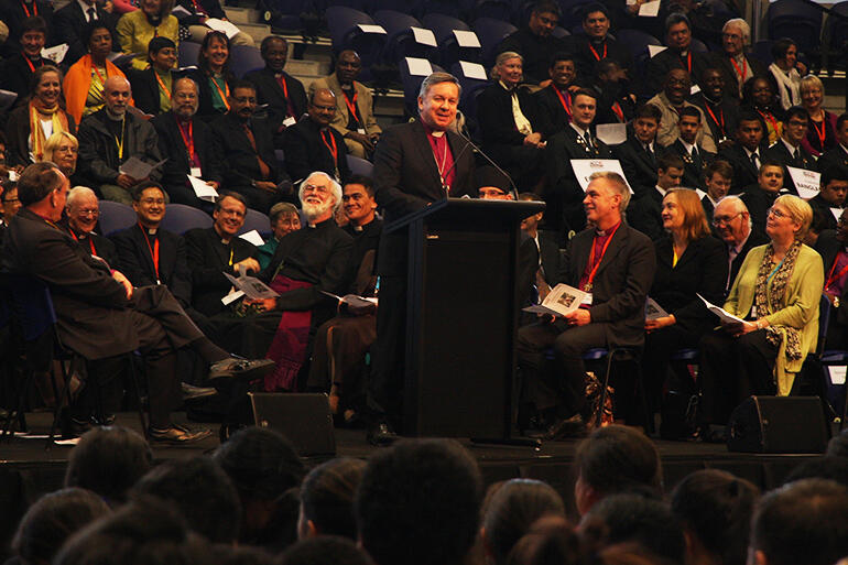 Archbishop David strikes a chord at the ACC powhiri in November 2012. That's the former Archbishop of Canterbury, Dr Rowan Williams, at left.