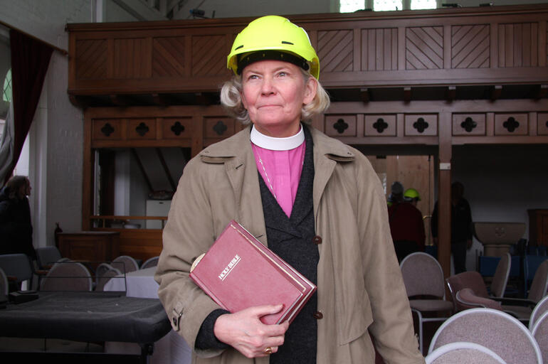 Bishop Victoria pauses before joining the crew who removed all the religious fittings and furniture from the chapel. Bishop Victoria pauses before joining the crew who removed all the religious fittings and furniture from the chapel.