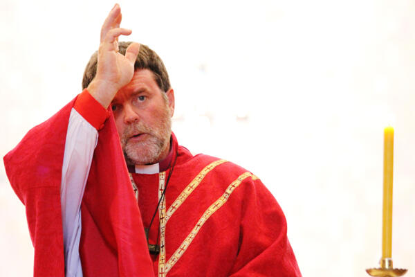 Archbishop-elect Philip Richardson gives the blessing at the eucharist.