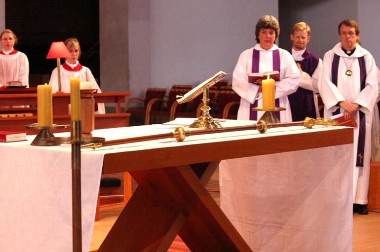 A solemn moment - Bishop John's staff, laid on the altar, ready for the next Bishop of Auckland.
