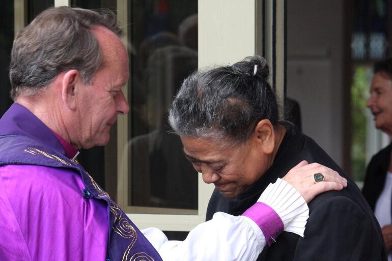 Bishop John blesses Mrs Betty Tevi, who is a cathedral parishioner.