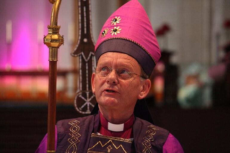 Bishop John considers his crozier, or bishop's staff.
