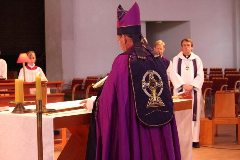Bishop John lays down the pastoral staff which he picked up 15 years ago.