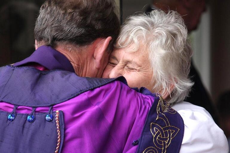 Lady Beverly Reeves congratulates Bishop John on his retirement.