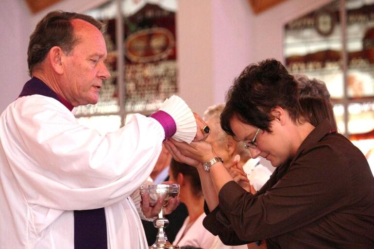 Making her communion.