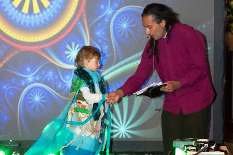 Bishop Justin presents an award to April Jackson(4) for her costume, entitled: 'Eastbourne'.