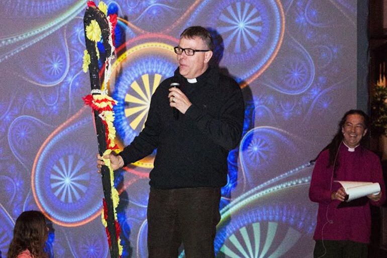 Dean Digby Wilkinson presents a new crozier to the Bishop. The kids made it - out of toilet rolls.