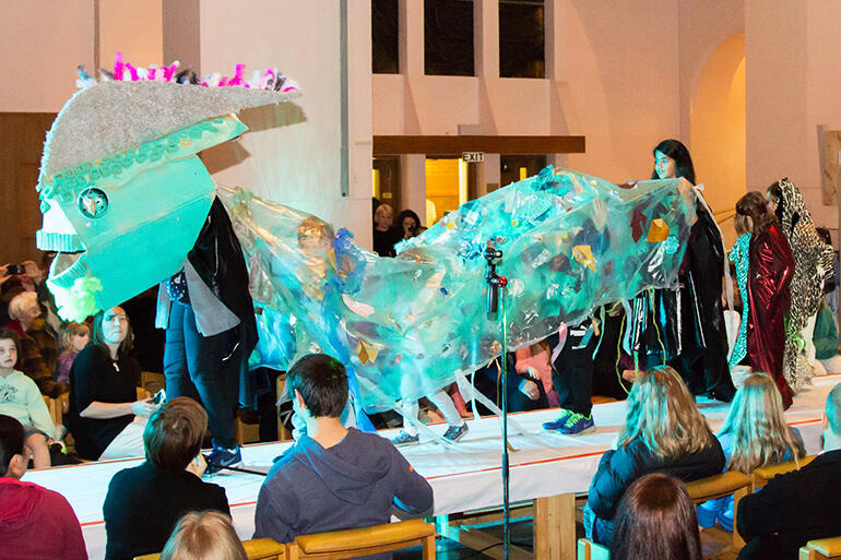 Kids from the Parish of Pauatahanui model their giant fish costume - and highlight the problem of chemical runoff into their inlet.
