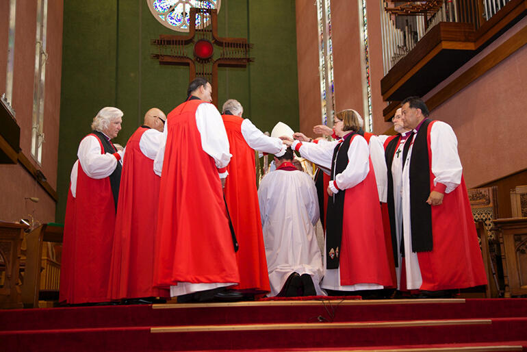 Apostolic succession - the gathered bishops lay their hands on the bishop elect. Apostolic succession - the gathered bishops lay their hands on the bishop elect.