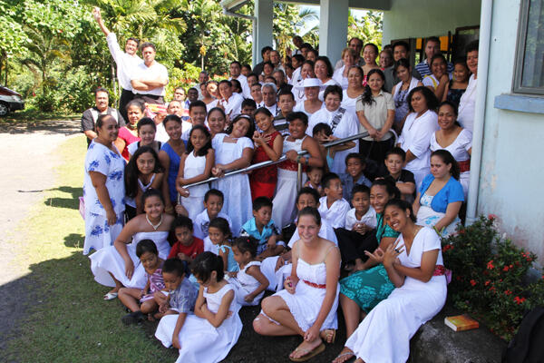 After the Easter Sunday morning service, the congregation at All Saints' Apia gathers on the side porch. 