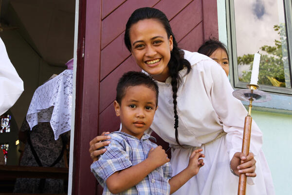 Robyn Lei Sam, an acolyte for the Easter morning service at All Saints' Apia, with her brother Arthur.