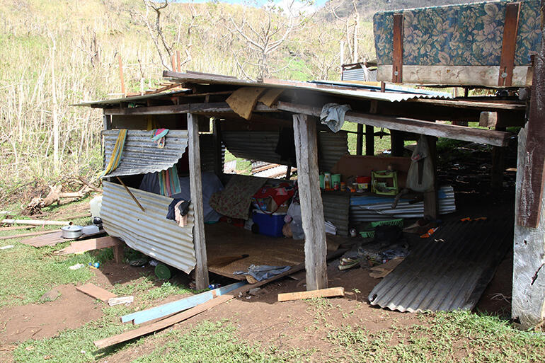 A new makeshift bedroom, built among the foundations of Mosese Kakaramu's house. A new makeshift bedroom, built among the foundations of Mosese Kakaramu's house.
