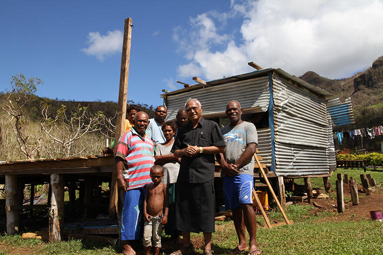 Archbishop Winston with Mosese Kakaramu (left). The Maniava community would meet in his house for worship.