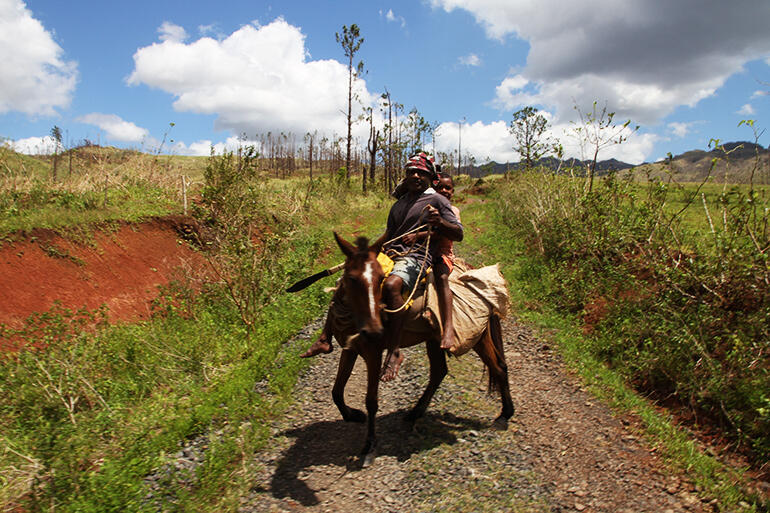 The preferred mode of transport on the road into Maniava.