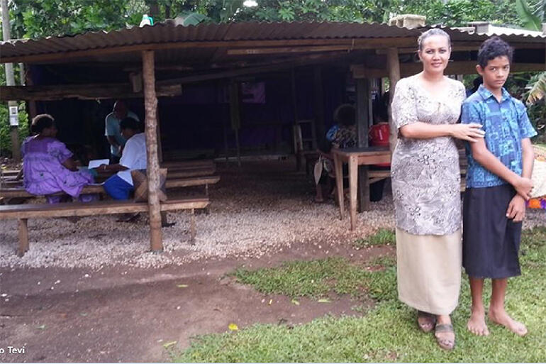 Eleni Levin-Tevi with one of the youngsters from the Seaside Anglican Church - before Cyclone Pam flattened the place.