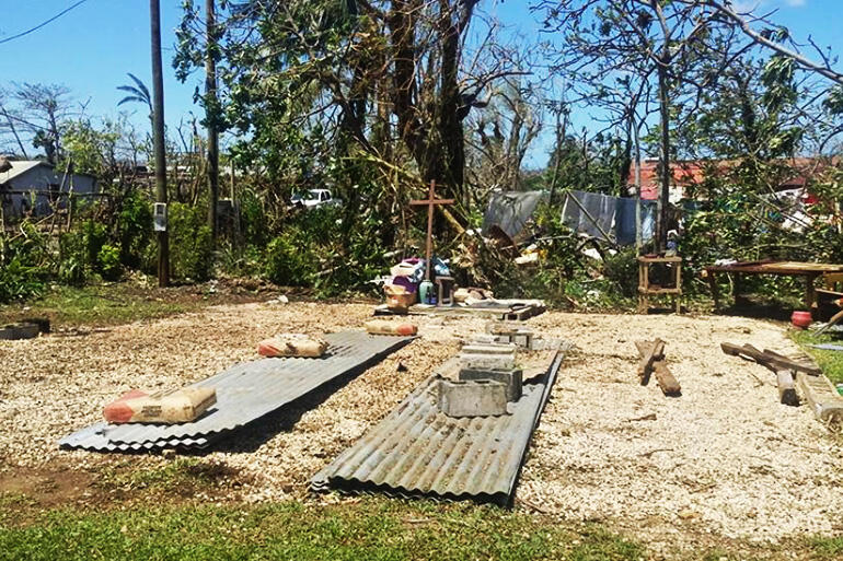 The site cleared, the salvageable iron neatly stacked - this is Seaside Anglican Church today. Note the cross beneath the tree.