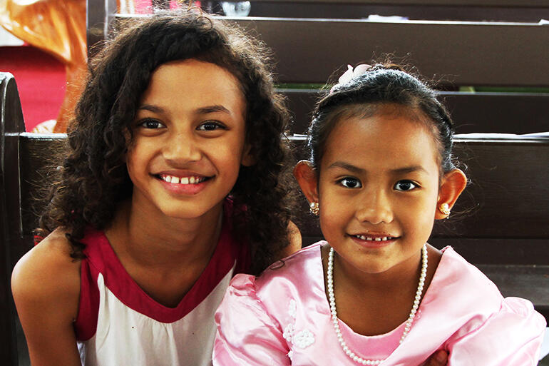 Friends - Laisa Tohi and Kalolaine Taufa following the Sunday baptism and confirmations.