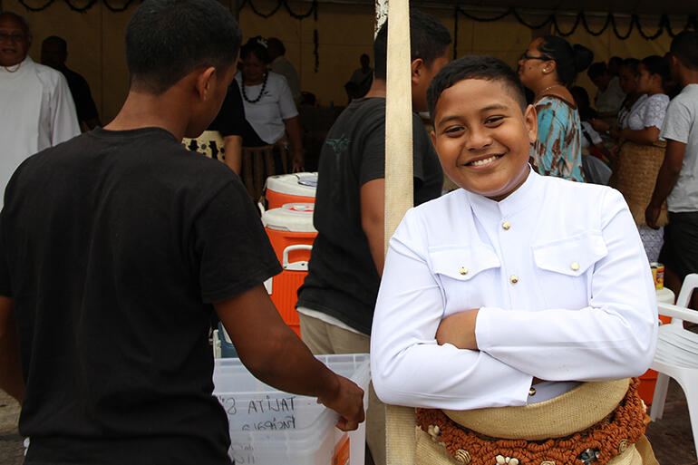 Senituli Tongia is the young man about town here - at the feast after the Sunday confirmations.