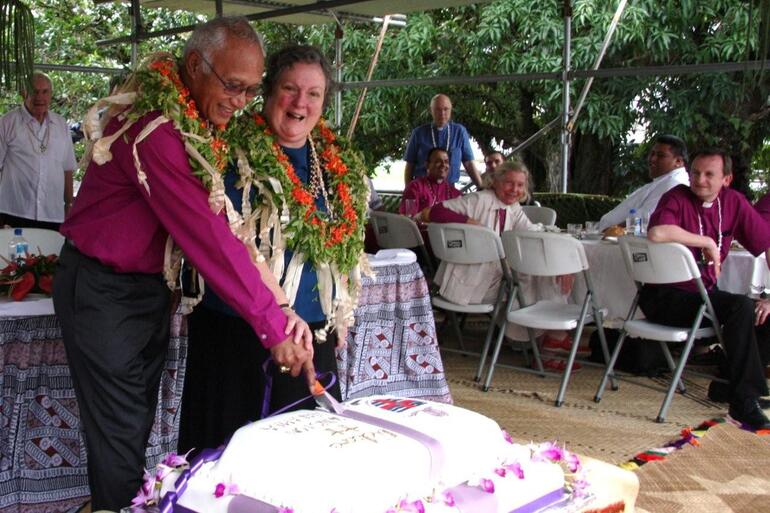 Archbishop Winston and Sue Halapua cut the commemorative cake. Lunch was served in prefab shelters in the cathedral grounds.