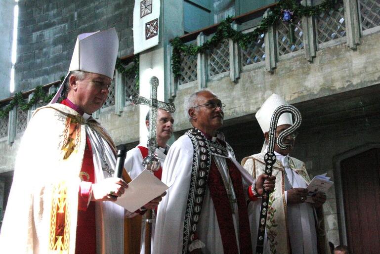 Bishop Winston, now wearing the cope of his new office, and bearing his crozier, faces the congregation. Bishop Winston, now wearing the cope of his new office, and bearing his crozier, faces the congregation.