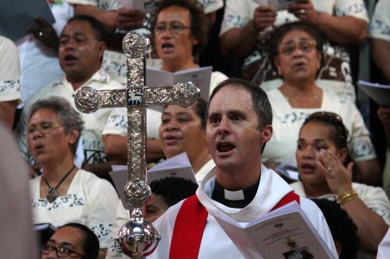 General Secretary Michael Hughes - bearing the Primatial Cross, and belting out the hymns. General Secretary Michael Hughes - bearing the Primatial Cross, and belting out the hymns.