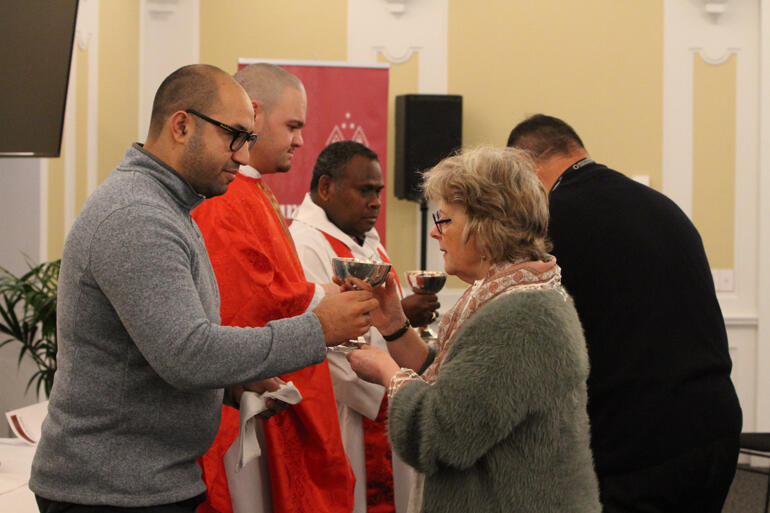 Rev Isaac Beach offers the chalice to Melbourne's Bishop of Monomeeth Rt Rev Kate Prowd. Rev Isaac Beach offers the chalice to Melbourne's Bishop of Monomeeth Rt Rev Kate Prowd.