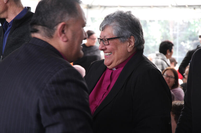 Bishop-elect Wai greets people at the pōwhiri before the ordination.