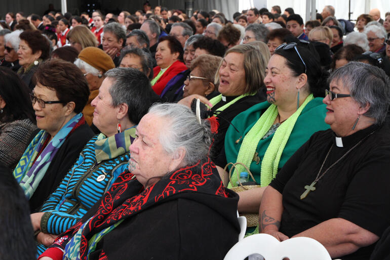 Smiles break out at Selwyn Parata's quip as he speaks for the visitors during the morning's pōwhiri.