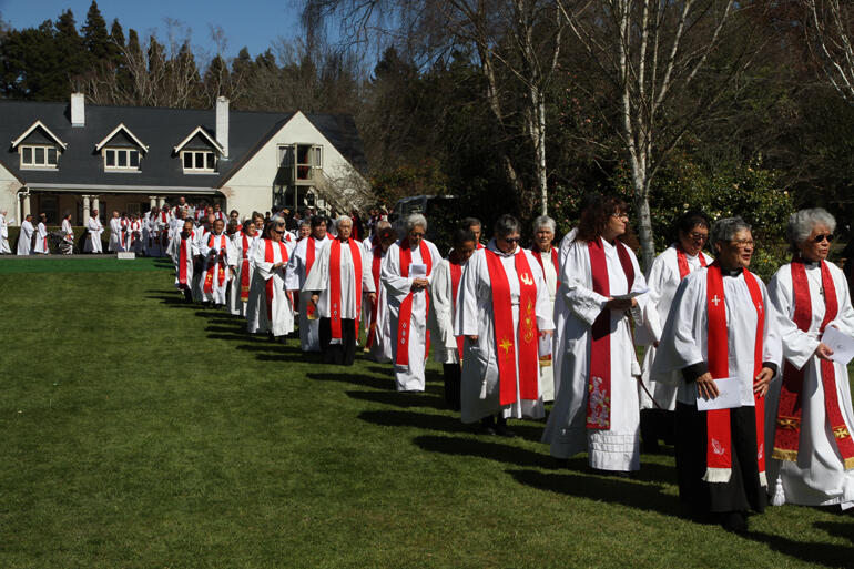 Some of the 218 robed clergy that turned out process toward the worship tent.