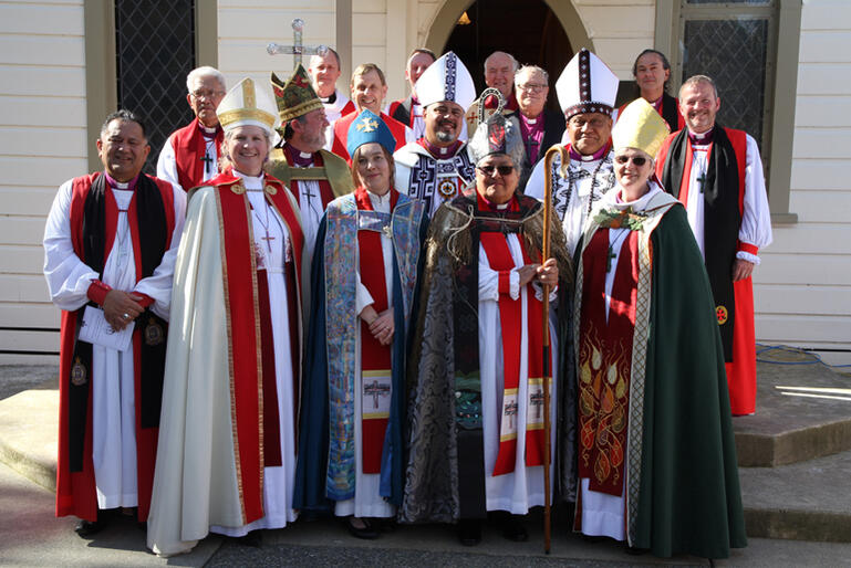 The House of Bishops assembles on the Rathkeale College chapel steps with their new sister bishop.