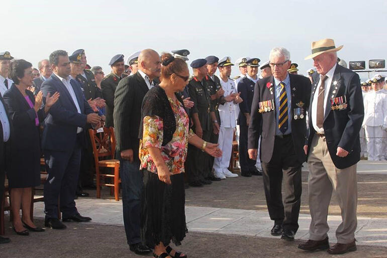 His wreath laid, Tony Madden, who is one of three Kiwi survivors from the Battle of Crete, is escorted to greet May Lloyd.