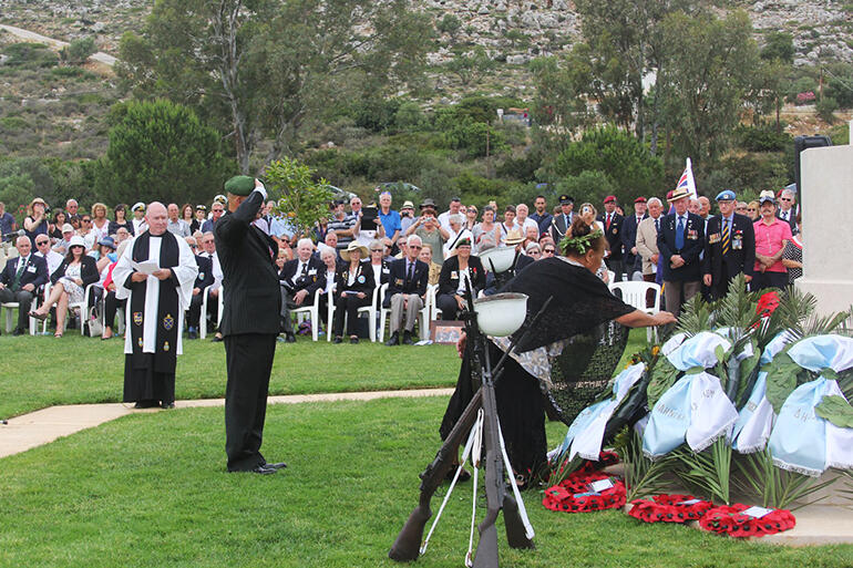 Souda Bay War Cemetery: Colenso salutes while May lays a wreath in honour of the men from the 28 Maori Battalion who died in Crete. Souda Bay War Cemetery: Colenso salutes while May lays a wreath in honour of the men from the 28 Maori Battalion who died in Crete.