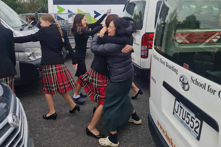 Hukarere pupils can't contain their excitement at seeing each other this May, hugging by the vans that took them to safety in February. Hukarere pupils can't contain their excitement at seeing each other this May, hugging by the vans that took them to safety in February.