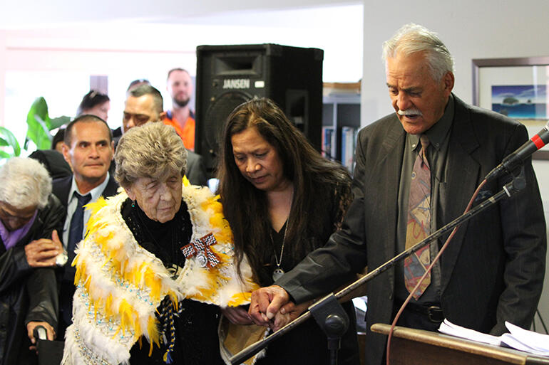 A prayer seeking God's blessing: May, Tina Mackey (May and Dave's daughter) and Rev Nehe Dewes, long-time Mt Eden prison chaplain.