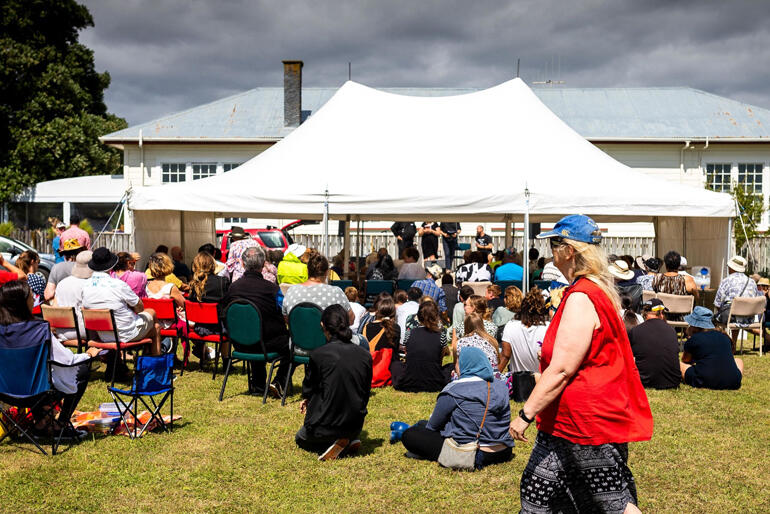 Māori and Pākehā Anglicans meet for Waitangi Day on the field that stands between their two churches on Te Rauparaha Street in Ōtaki.