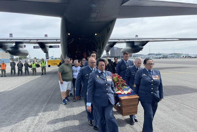 Air Force personnel carry Bishop Richard Wallace's coffin from the Hercules aircraft which returned him to Ōtautahi. Air Force personnel carry Bishop Richard Wallace's coffin from the Hercules aircraft which returned him to Ōtautahi.