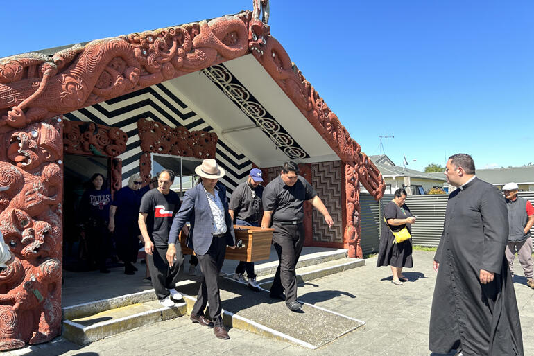 Ven Mere Wallace and close whānau walk with Bishop Richard as he departs the wharenui at Waipatu Marae in Hastings yesterday.