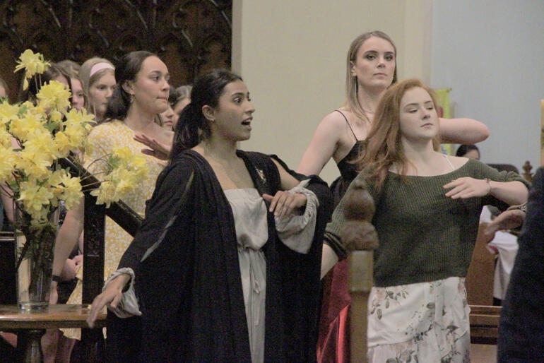 Selwyn cultural rep Laura Gemmell wears her Selwyn choral scholar robes as she leads the haka wāhine she composed for the College.