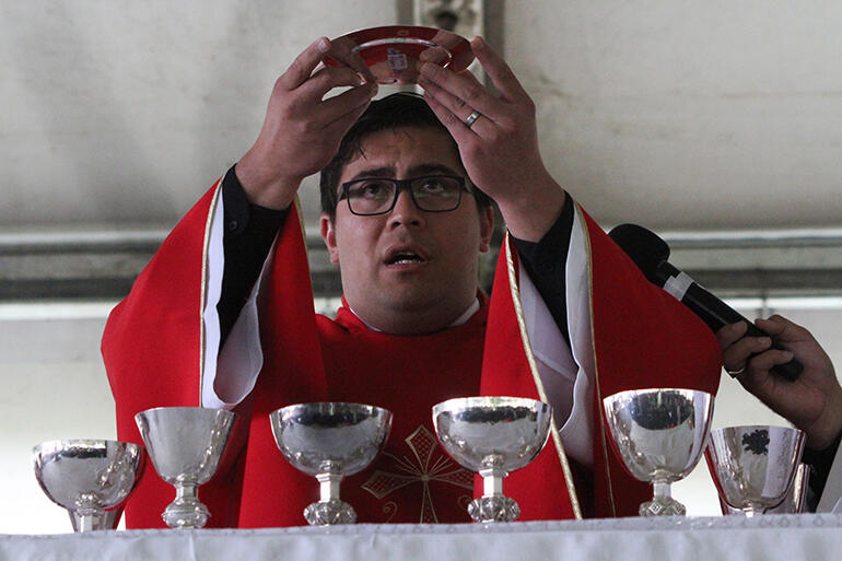 The Rev Wiremu Anania celebrating the Eucharist. He is the youngest, most recently ordained priest in Te Pihopatanga, 