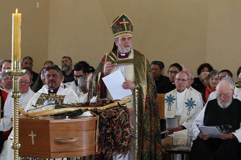Archbishop Philip addresses the mourners at St Joseph's - with his bishop's crozier resting on Tiki's casket.