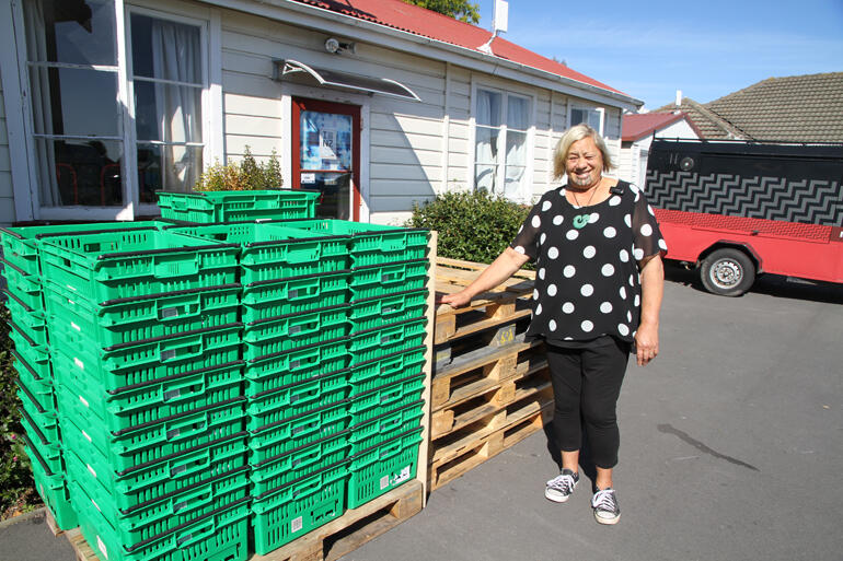 Archdeacon Nganehu Mere Wallace stands outside the Waipounamu Centre's Pokapū Kai foodsharing zone. 