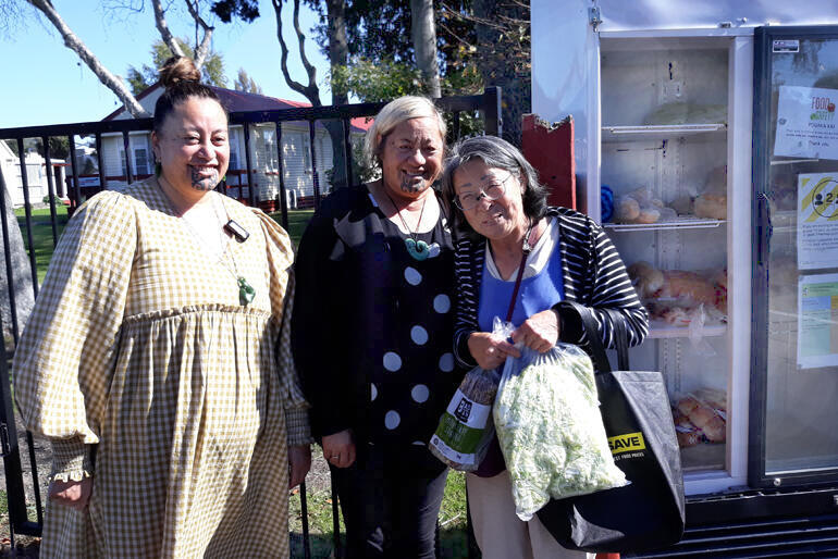 Susan Wallace and Archdeacon Mere chat with Patchinee Mitpracaton, who has stopped by the Pouaka Kai to collect some food for a friend in need.