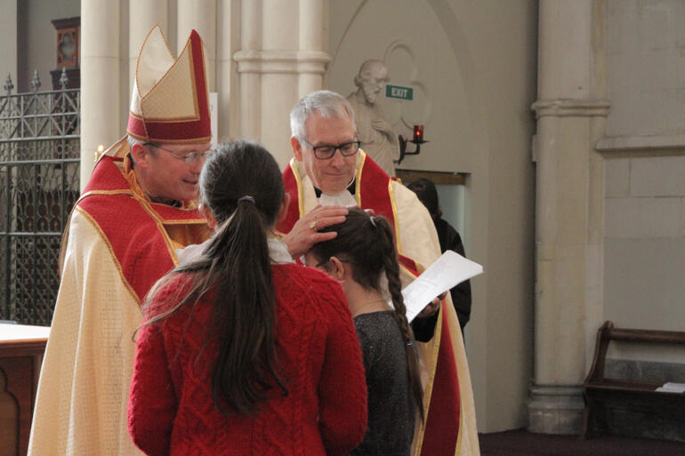A joyous moment for St Paul's as Bishop Steven confirms Ziva Curtis at St Joseph's Cathedral – after the chaos caused by last week's fire.