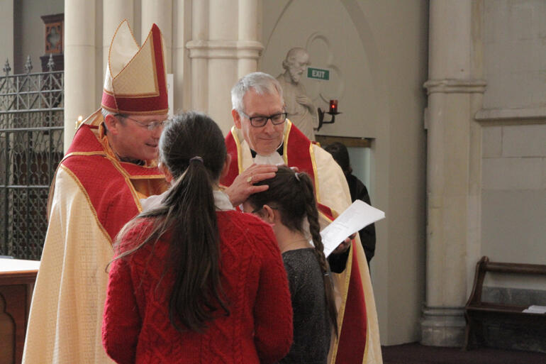 A joyous moment for St Paul's as Bishop Steven confirms Ziva Curtis at St Joseph's Cathedral – after the chaos caused by last week's fire. A joyous moment for St Paul's as Bishop Steven confirms Ziva Curtis at St Joseph's Cathedral – after the chaos caused by last week's fire.