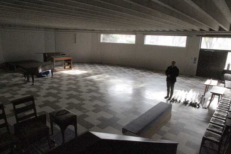 Dean Tony stands in St Paul's Cathedral crypt where floodwater from fire hoses has knocked out all of its lighting, heating and wiring.