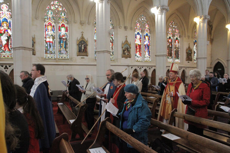 St Paul's congregation celebrate at St Joseph's Cathedral after a generous offer of space to worship from the Catholic Diocese of Dunedin.