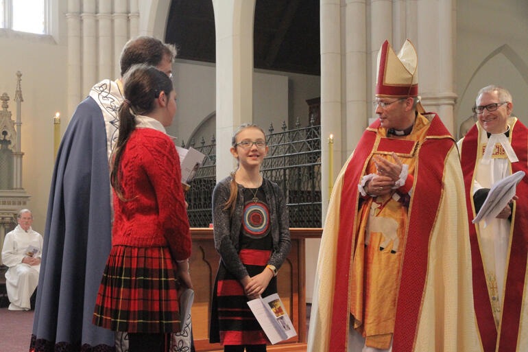 Two highs in the week after St Paul's Cathedral fire: Bishop Steven welcomes Ziva Curtis for her confirmation in St Joseph's Cathedral, Dunedin. Two highs in the week after St Paul's Cathedral fire: Bishop Steven welcomes Ziva Curtis for her confirmation in St Joseph's Cathedral, Dunedin.
