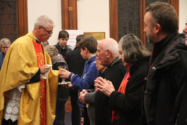 Hui members recieve the Eucharist from Fr Stephen King at St Peter's on Willis. Hui members recieve the Eucharist from Fr Stephen King at St Peter's on Willis.