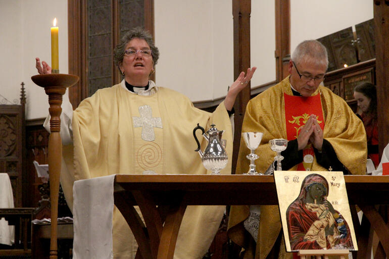 'Lift your hearts up to the Lord!' Archdeacon Wendy Scott celebrates the opening mass.